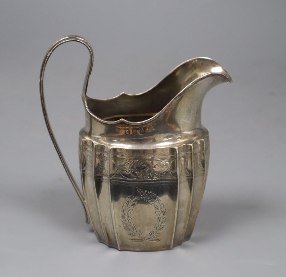 A George III Irish silver helmet shaped cream jug by Gustavus Byrne, Dublin, 1801, 13.3cm, 4.5 oz.